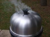 The Cobb Premier Ultimate Barbecue Cooking System.